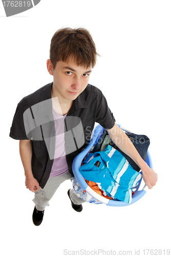 Image of Teenager with basket of clothing