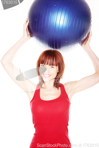 Image of Smiling Woman Holding Pilates Ball