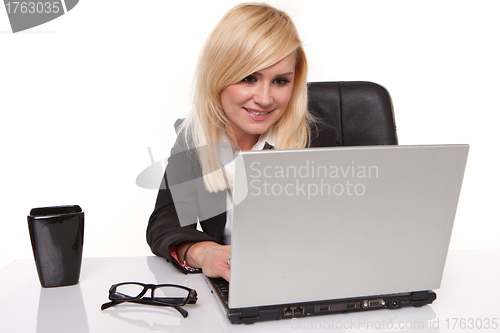 Image of Blonde businesswoman chatting on her mobile