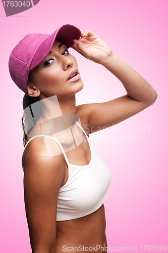 Image of Tan woman in pink cap