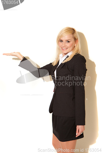 Image of Smiling blonde professional saleswoman