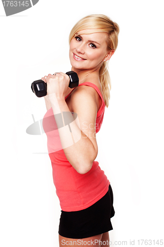 Image of Pretty girl keeping her beautiful shape exercising