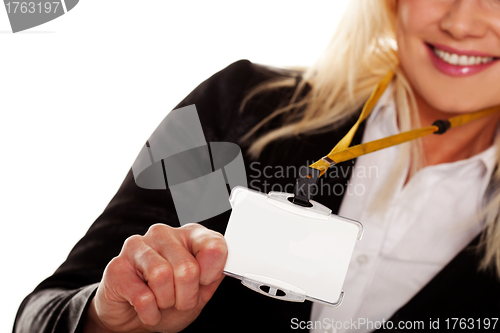 Image of Businesswoman holding up her blank ID tag