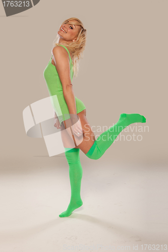 Image of Bright green long stockings on a pretty girl