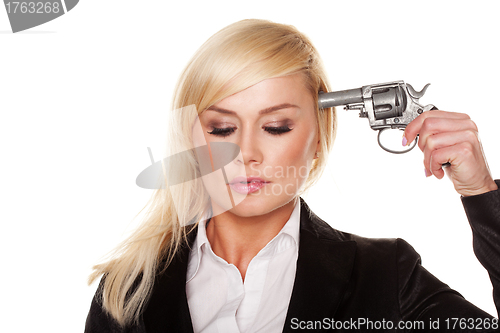 Image of Professional woman holding a gun to her head
