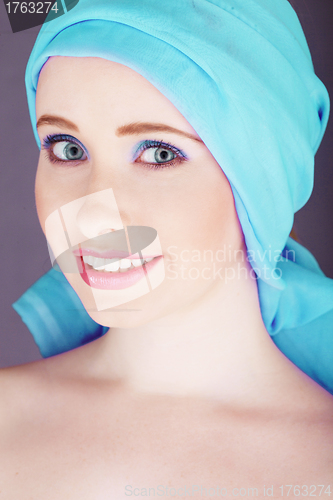 Image of Cute woman with blue headscarf