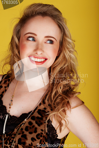 Image of smiling woman wearing top with leopard prints