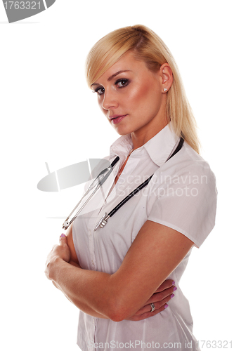 Image of Young blonde attractive doctor with arms crossed