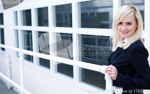 Image of Businesswoman and corporate building