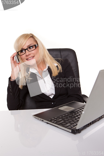 Image of Businesswoman in glasses working