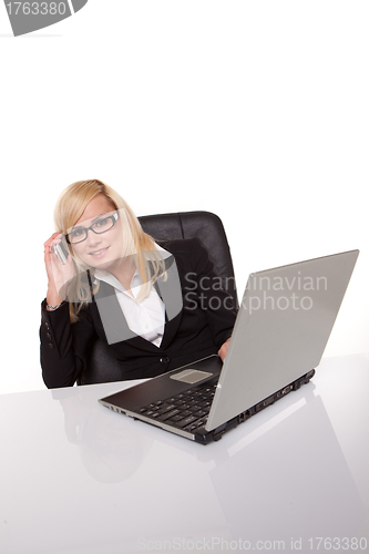 Image of Businesswoman in glasses working