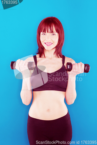 Image of Woman Holding Pair Of Dumbbells
