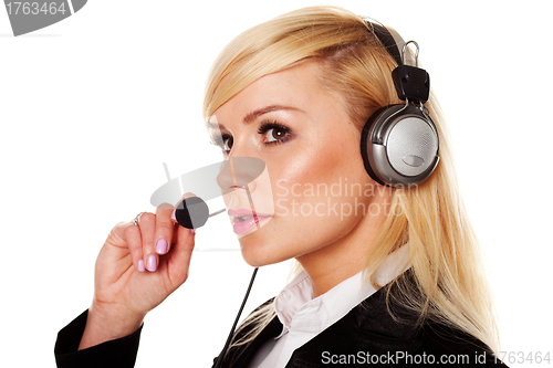 Image of Woman wearing headphones and microphone