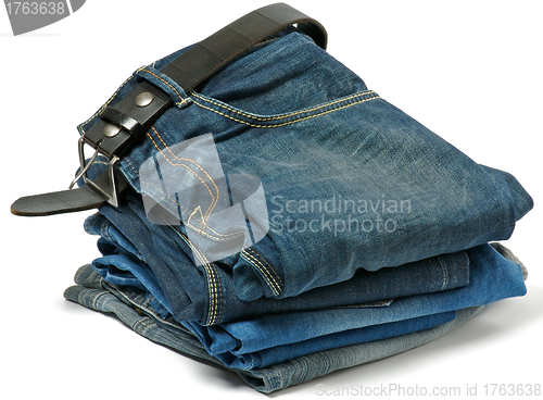 Image of Stack of Old jeans and Belt