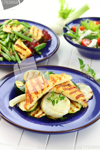 Image of Grilled cheese with vegetables and salad