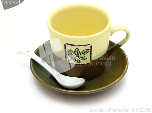 Image of Ceramic cup on a saucer with drawing 