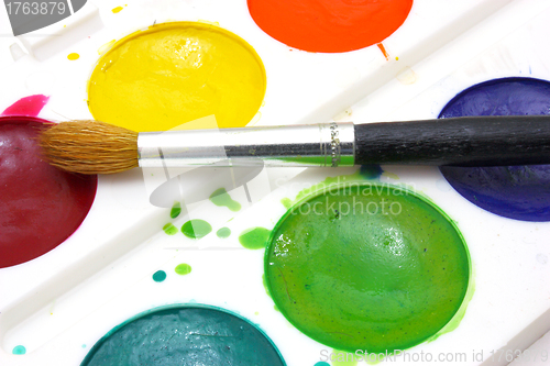 Image of Paints with brushes