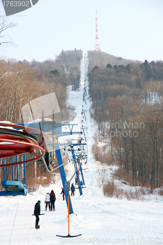 Image of Skiers go on the lift on mountain