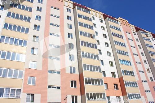 Image of The inhabited high house against the blue sky