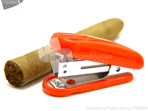 Image of Red stapler and cigar 