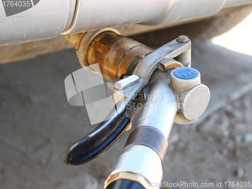 Image of  refueling of the hybrid car by gas 