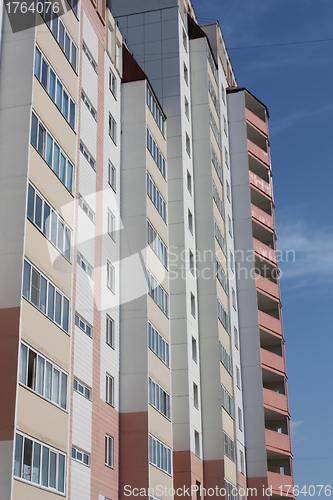 Image of The inhabited high house against the blue sky