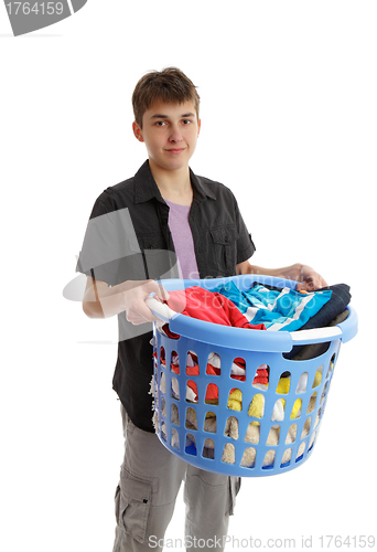 Image of Teenager holding a basket of housework