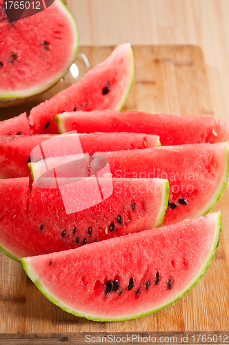 Image of fresh watermelon on a  wood table