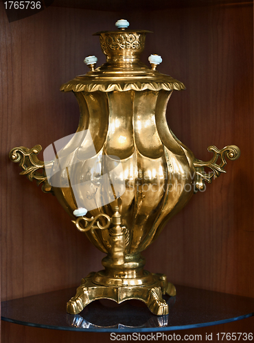 Image of Samovar on brown background