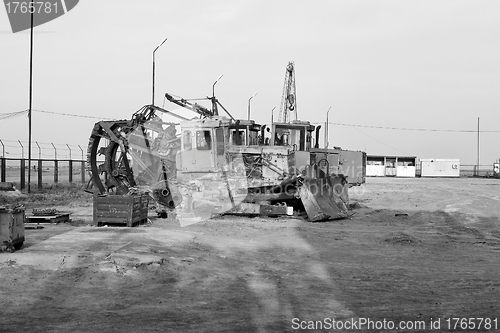 Image of Backhoe and digger at a construction site