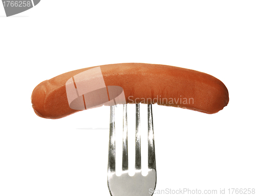 Image of Close up of sausage and fork isolated