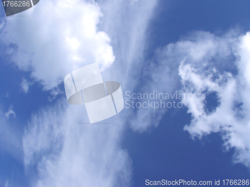 Image of white fluffy clouds in the blue sky