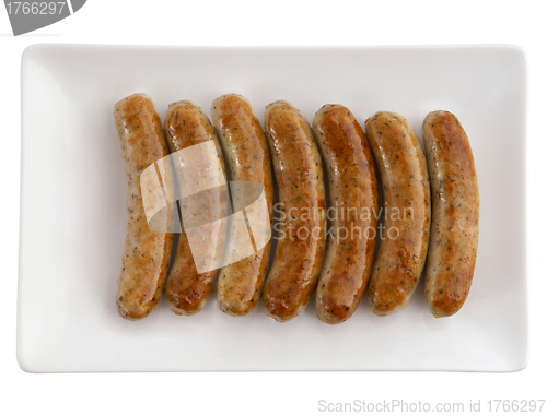 Image of Roasted sausages on white plate and beer