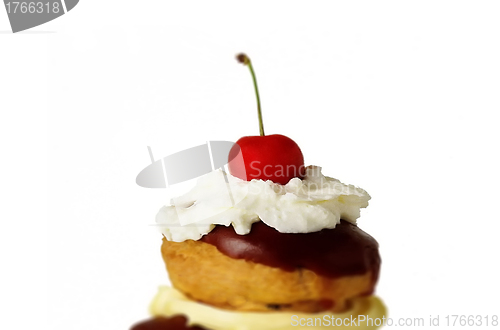 Image of tasty cake with cherry topping, isolated on white