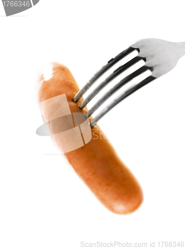 Image of close up of sausage and fork on white background