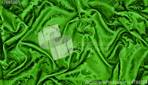 Image of abstract background green silk fabric with waves