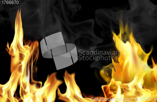 Image of Close-up of fire and flames on a black background