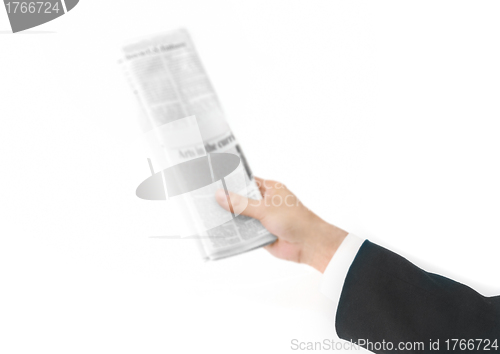 Image of newspaper in the hand