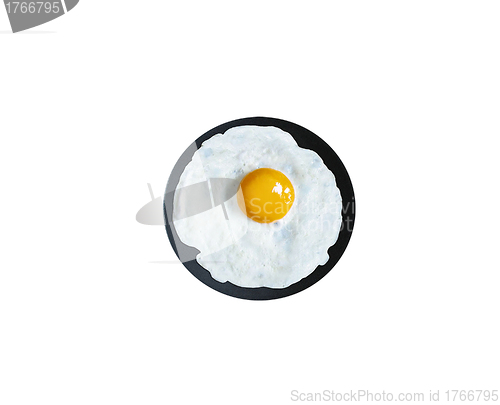 Image of Fried Egg in a frying pan isolated on white, top view