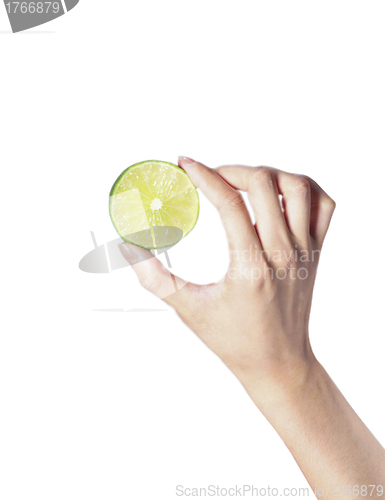 Image of fresh ripe lime in hand on white background