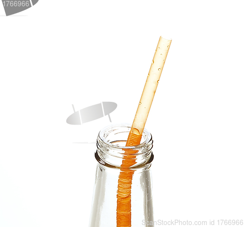 Image of a straw in a bottle isolated on white background