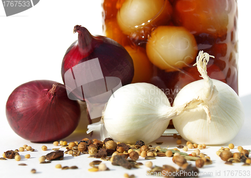 Image of Onions, spices and a jar