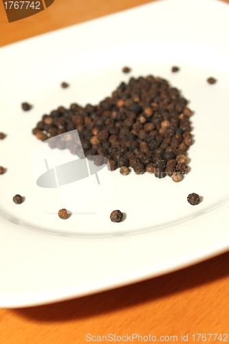 Image of pepper corns isolated heart