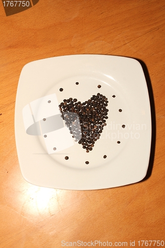 Image of pepper corns isolated heart