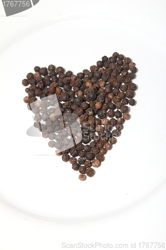 Image of pepper corns isolated heart