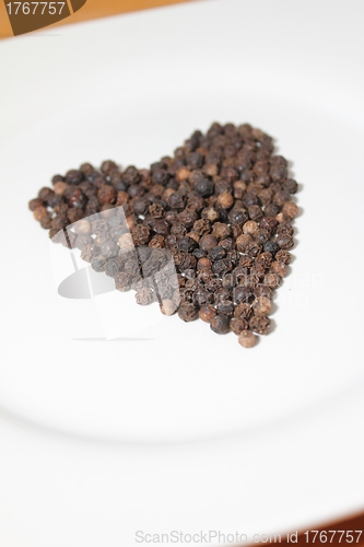 Image of pepper corns isolated heart