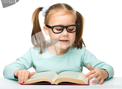 Image of Cute little girl with books