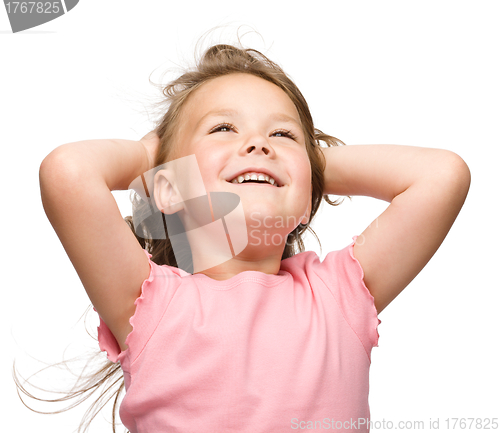 Image of Little girl is stretching and rising hands up