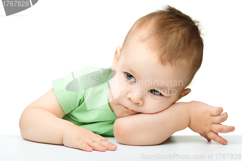 Image of Portrait of a cute and pensive little boy