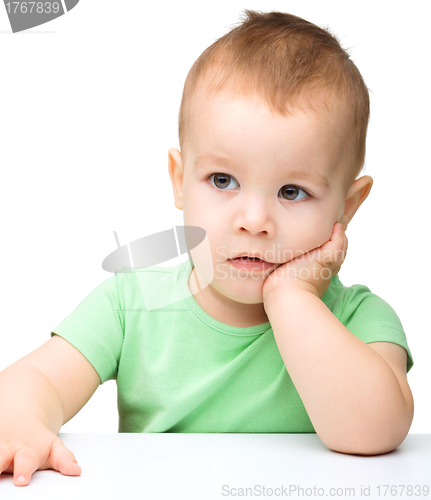 Image of Portrait of a cute and pensive little boy